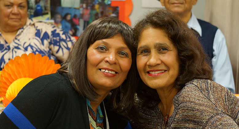 Caregiver and LGBT elder at a SAGE event