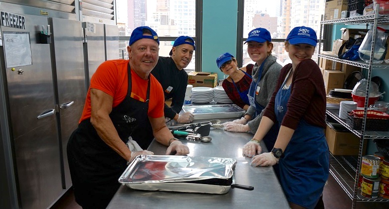 SAGE Volunteers in the kitchen preparing a meal