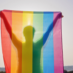 rainbow-flag-held-by-obscured-person