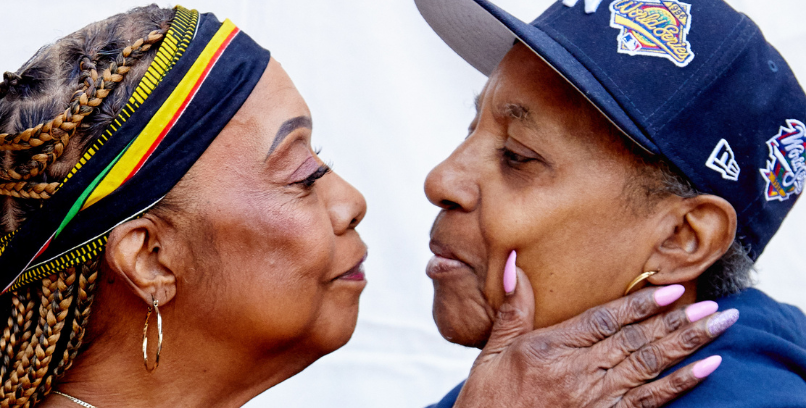 two older lesbian women holding each other